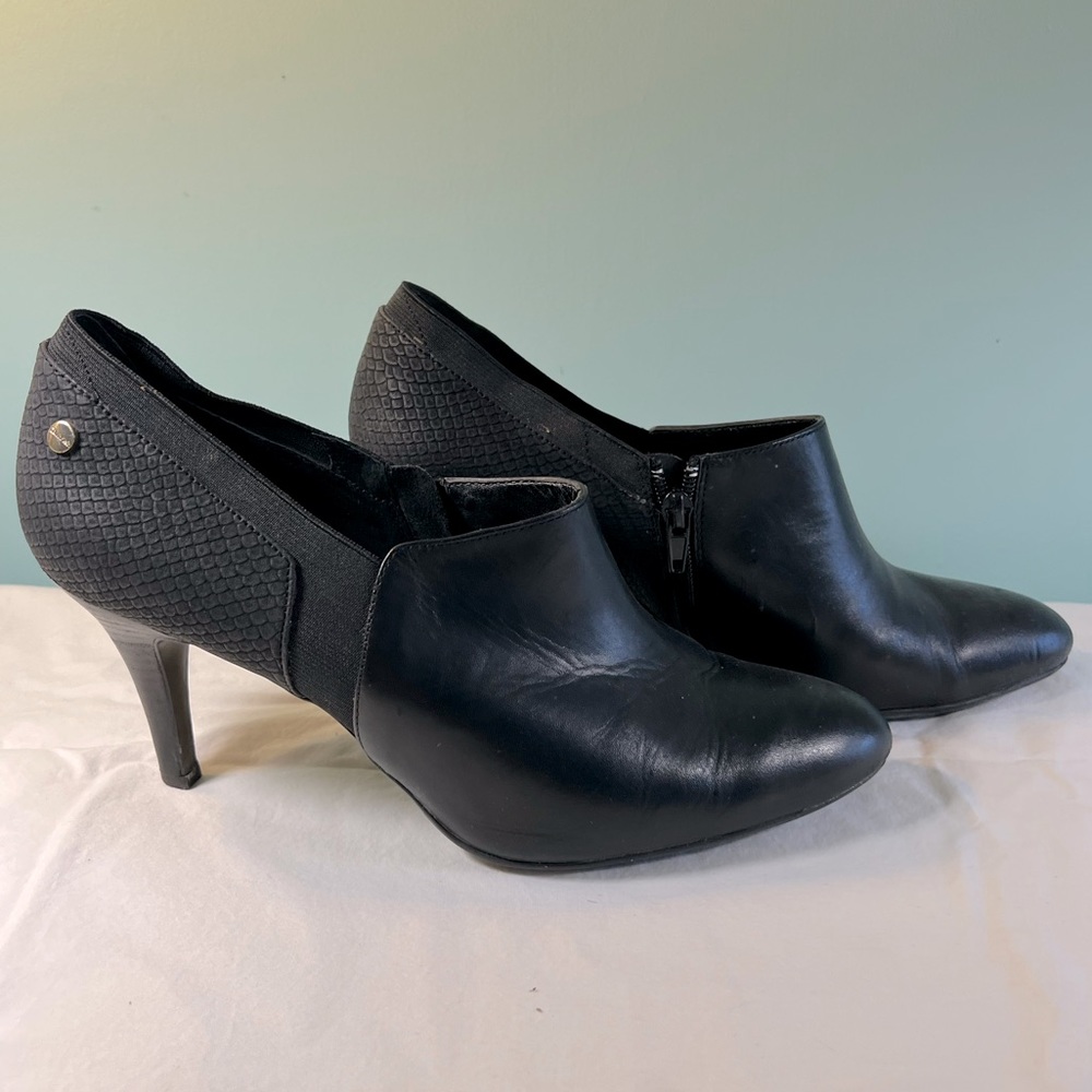 Calvin Klein Black Ankle Booties with inside zipper, faux snake on heel elastic.